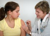 feature teen receiving vaccination