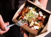 feature take out meal food womans-hand-is-holding-a-take-away-fresh-salad-in-a-lunch-box-picture-id1044224574