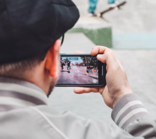 Man recording video on celllphone